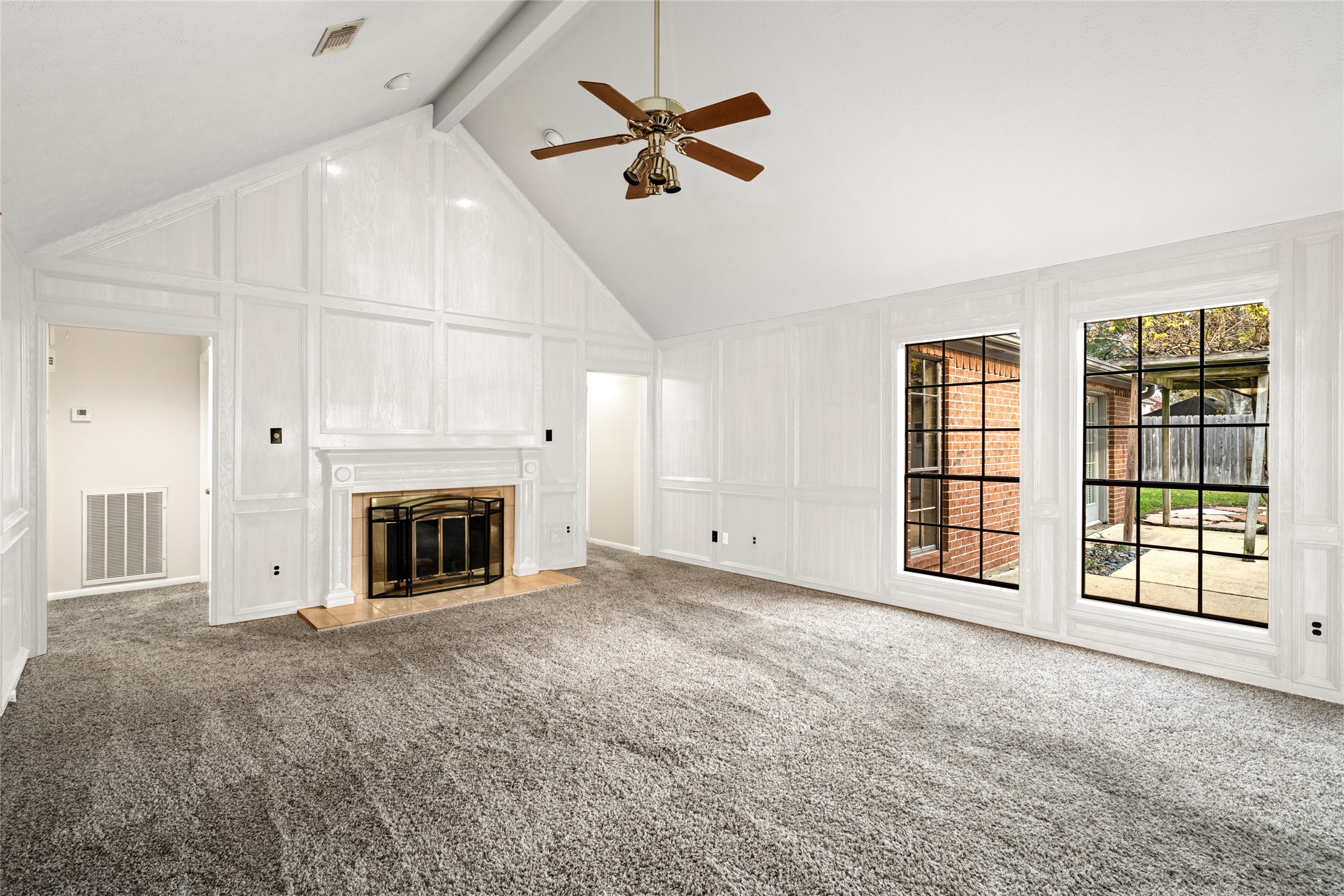 16106 Ridge Park Drive Houston, TX 77095 - Photo 3 of 23 a view of an empty room with a fireplace and a window