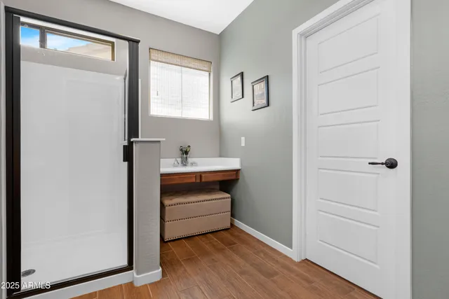 a bathroom with a granite countertop sink a toilet and a mirror