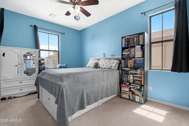 a view of backyard of house with green space and seating