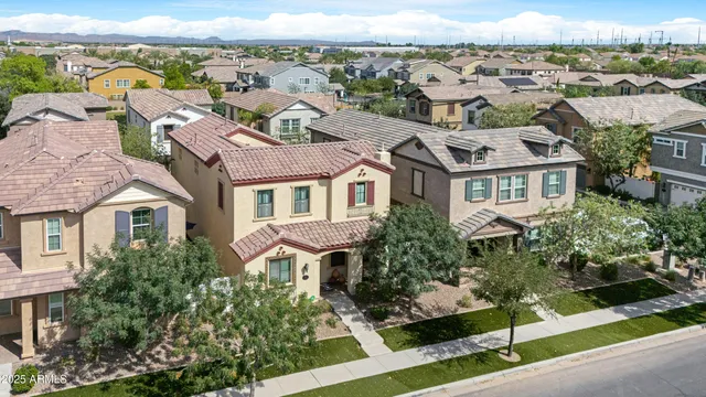 an aerial view of a house with outdoor space pool patio and lake view