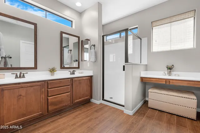 a view of a hallway with wooden floor and entryway