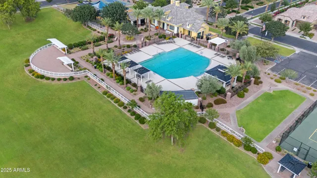a front view of residential houses with yard and green space