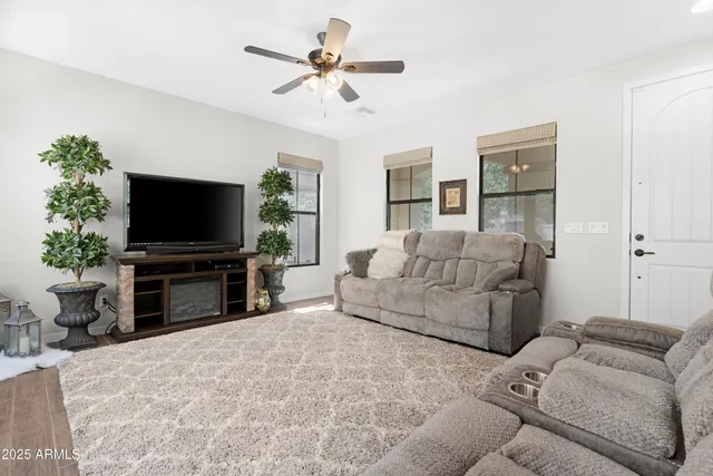 a living room with furniture and windows
