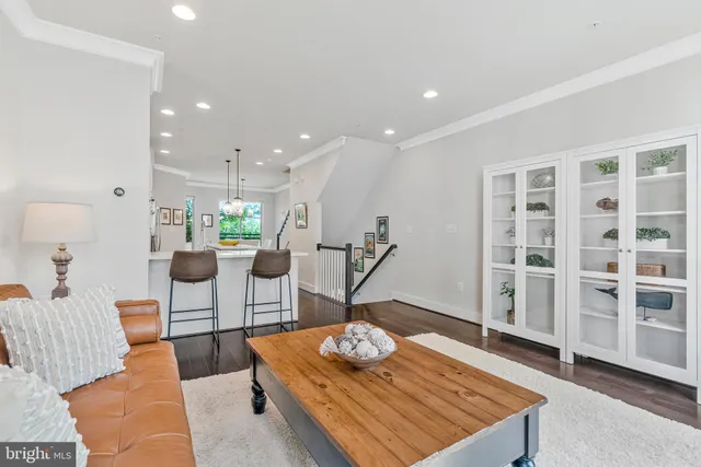 a living room with furniture rug and window