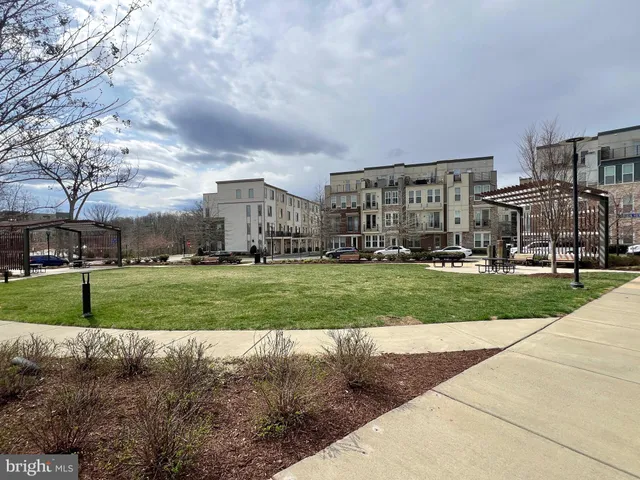 a childrens park with lots of swings and slides