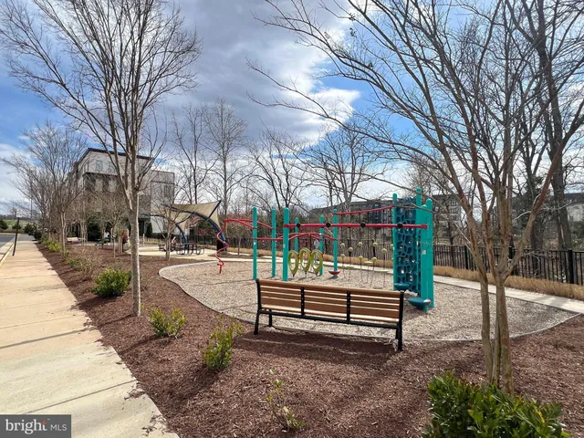 a swimming pool with outdoor seating and yard