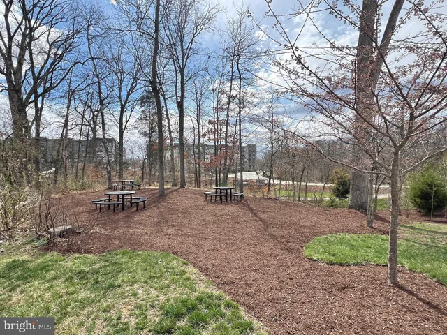 a view of balcony with wooden floor and fence
