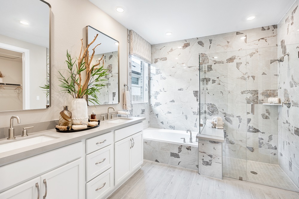 224 Amber Oak Lane Georgetown, TX 78628 - Photo 22 of 40 a bathroom with a double vanity sink toilet and shower