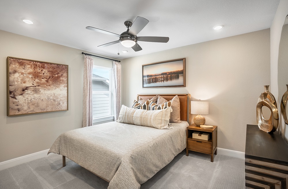 224 Amber Oak Lane Georgetown, TX 78628 - Photo 25 of 40 a bedroom with a bed and a painting on the wall