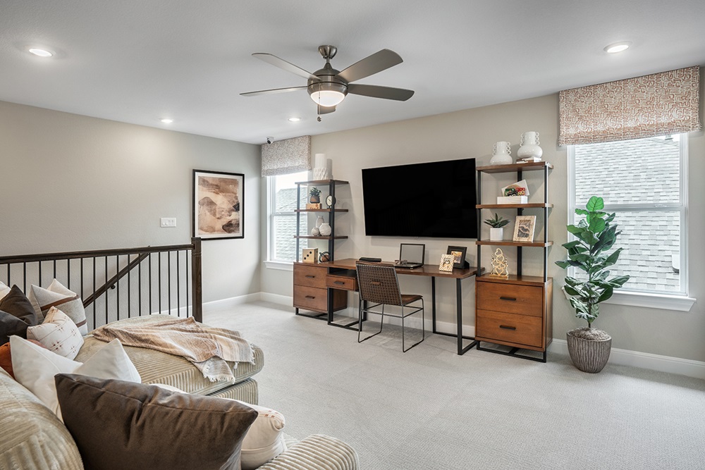 224 Amber Oak Lane Georgetown, TX 78628 - Photo 26 of 40 a living room with furniture and a flat screen tv