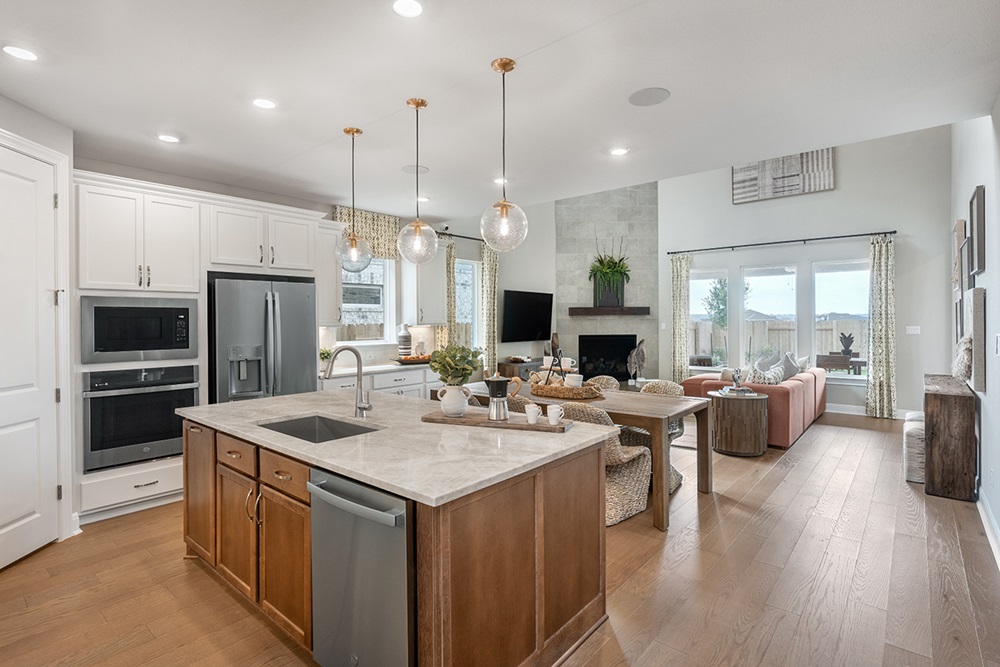 224 Amber Oak Lane Georgetown, TX 78628 - Photo 31 of 40 a large kitchen with a table and chairs