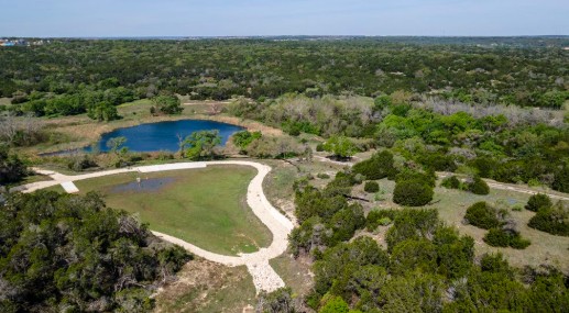 224 Amber Oak Lane Georgetown, TX 78628 - Photo 32 of 40 a view of a swimming pool and lake