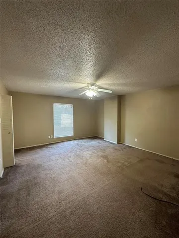 a view of a livingroom with a chandelier and fire place