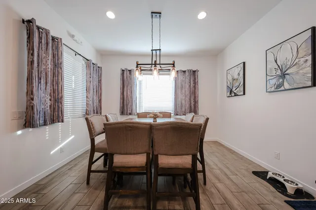 a dining room with furniture and window