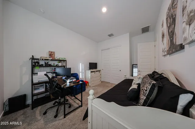 a living room with furniture a couch and a window