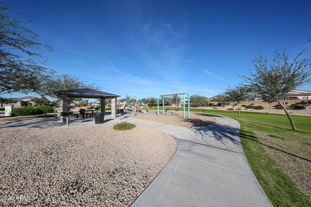 an aerial view of a residential houses with outdoor space