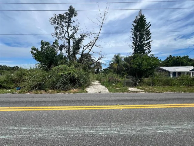 a view of a swimming pool with an outdoor space and seating area