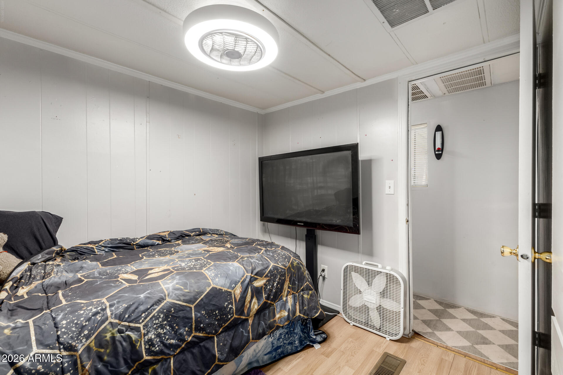 157 North 113th Way Apache Junction, AZ 85120 - Photo 15 of 27 a bedroom with a bed and a flat screen tv