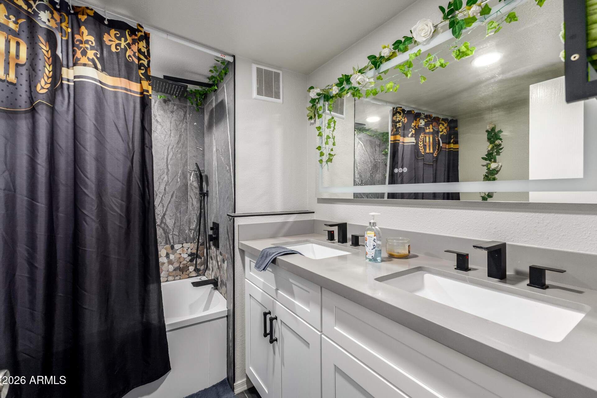 157 North 113th Way Apache Junction, AZ 85120 - Photo 16 of 27 a bathroom with a sink a mirror and a shower