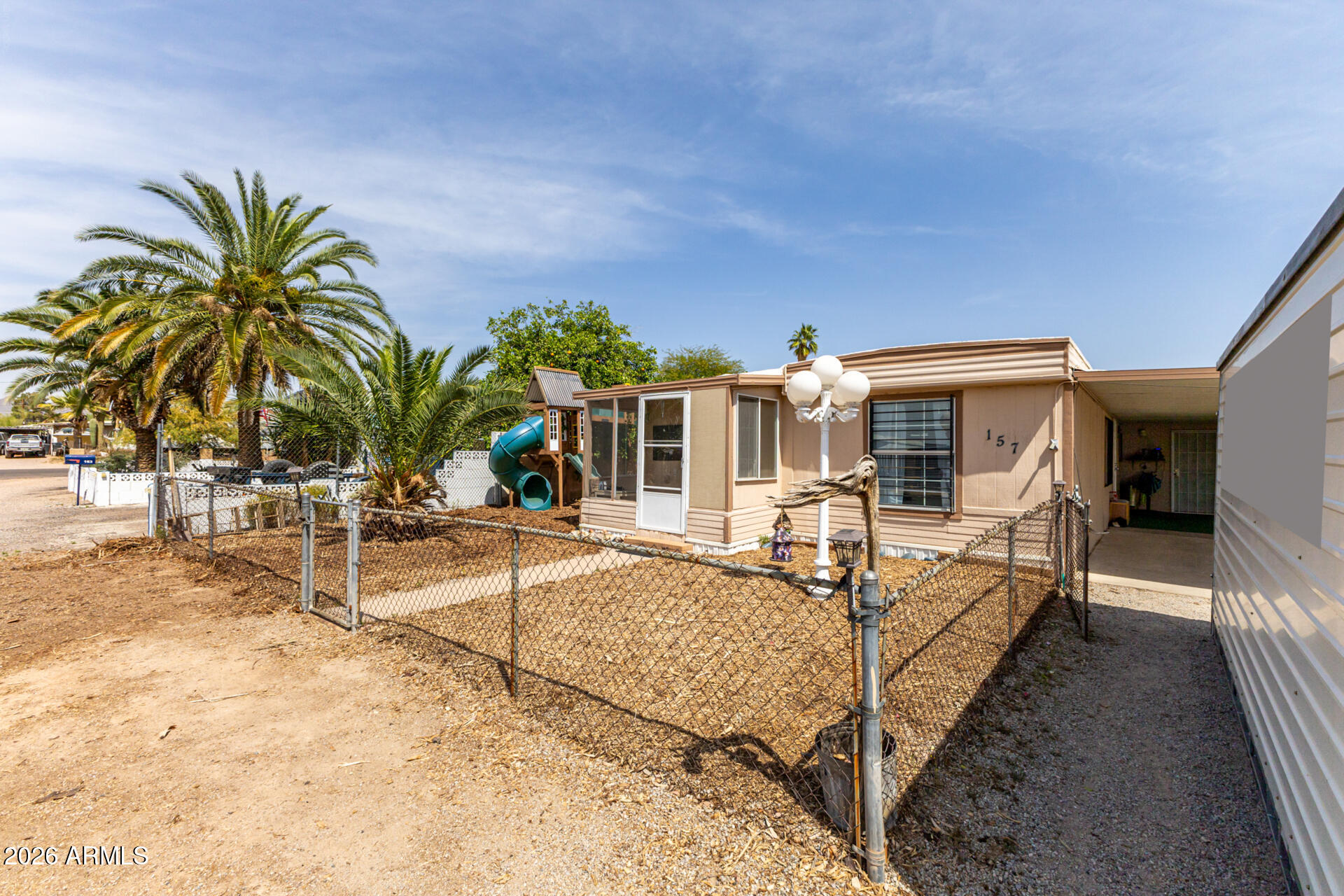 157 North 113th Way Apache Junction, AZ 85120 - Photo 3 of 27 a view of a house with backyard and sitting area