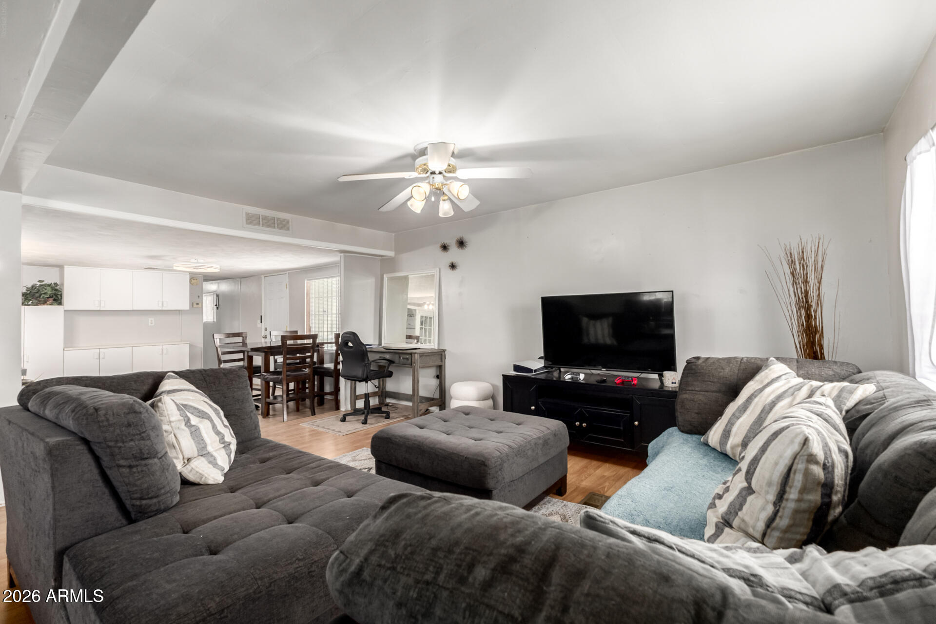 157 North 113th Way Apache Junction, AZ 85120 - Photo 7 of 27 a living room with furniture and a flat screen tv
