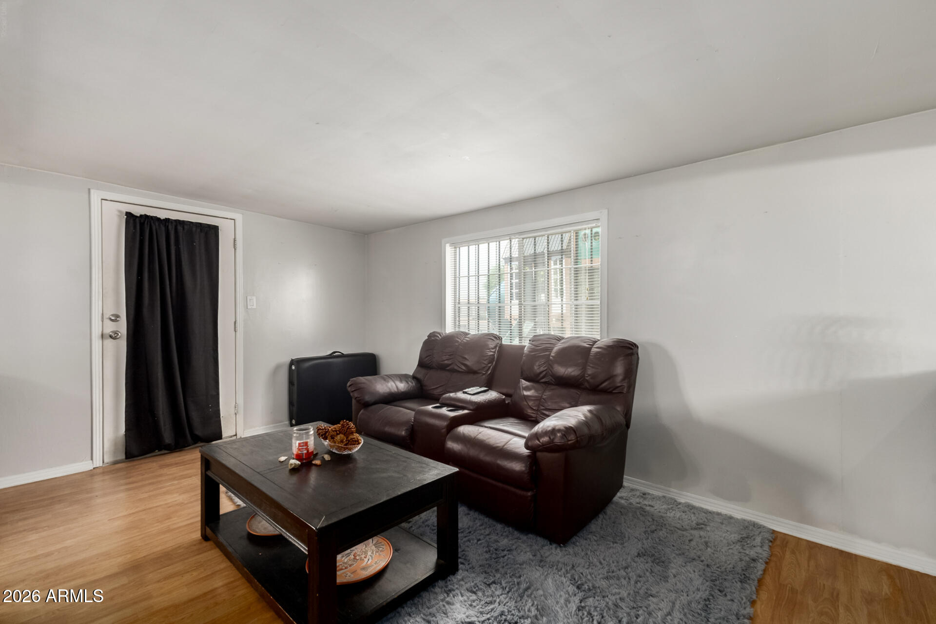 157 North 113th Way Apache Junction, AZ 85120 - Photo 9 of 27 a living room with furniture and a window