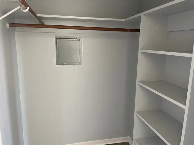 a view of an empty walk in closet