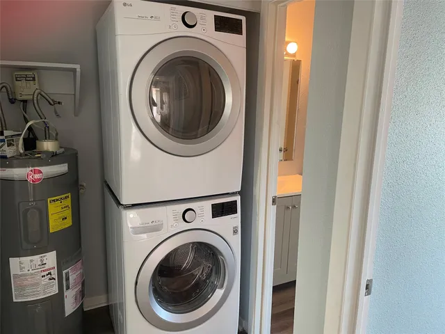 a view of a hallway with washer and dryer