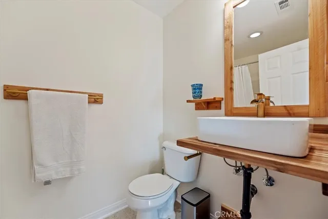 a bathroom with a sink and toilet