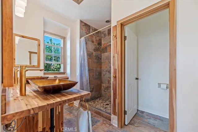 a bathroom with a tub and shower