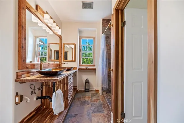 a view of a sink and a stove top oven