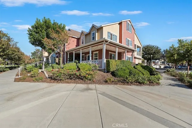 a front view of a house with a garden