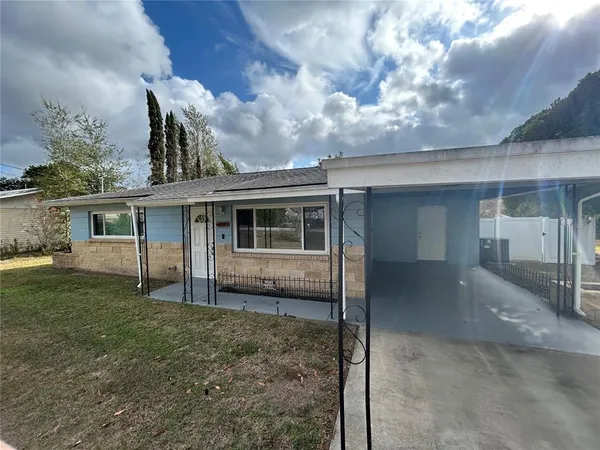 front view of a house with a yard