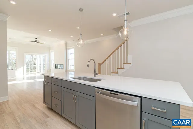 a kitchen with sink and window