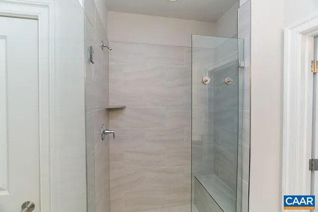 a bathroom with a sink vanity and a mirror