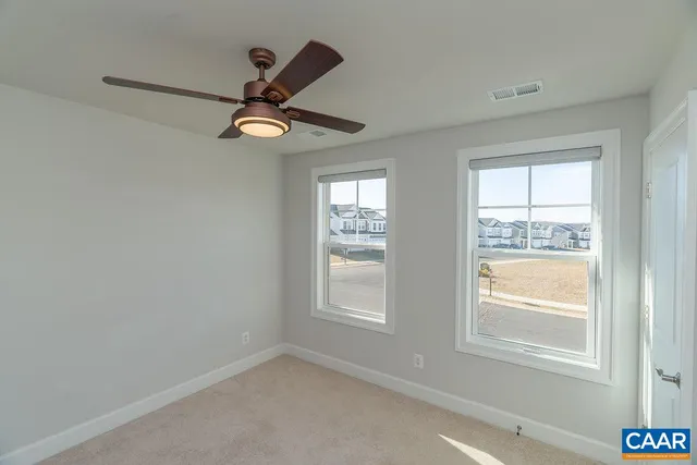a view of empty room with windows