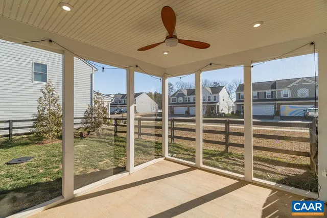 a view of a porch with a table and chairs