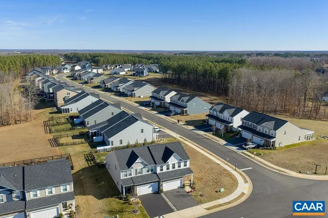 a view of a lake with couches chairs