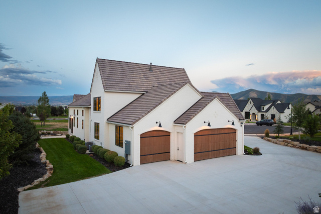 558 West Rheinfalls Circle Midway, UT 84049 - Photo 54 of 61 Stucco exterior with a tiled roof and wood-finish garage doors
