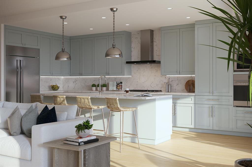 325 Golden Gate Point, Unit 602 Sarasota, FL 34236 - Photo 8 of 21 a kitchen with stainless steel appliances granite countertop a sink a stove and a refrigerator