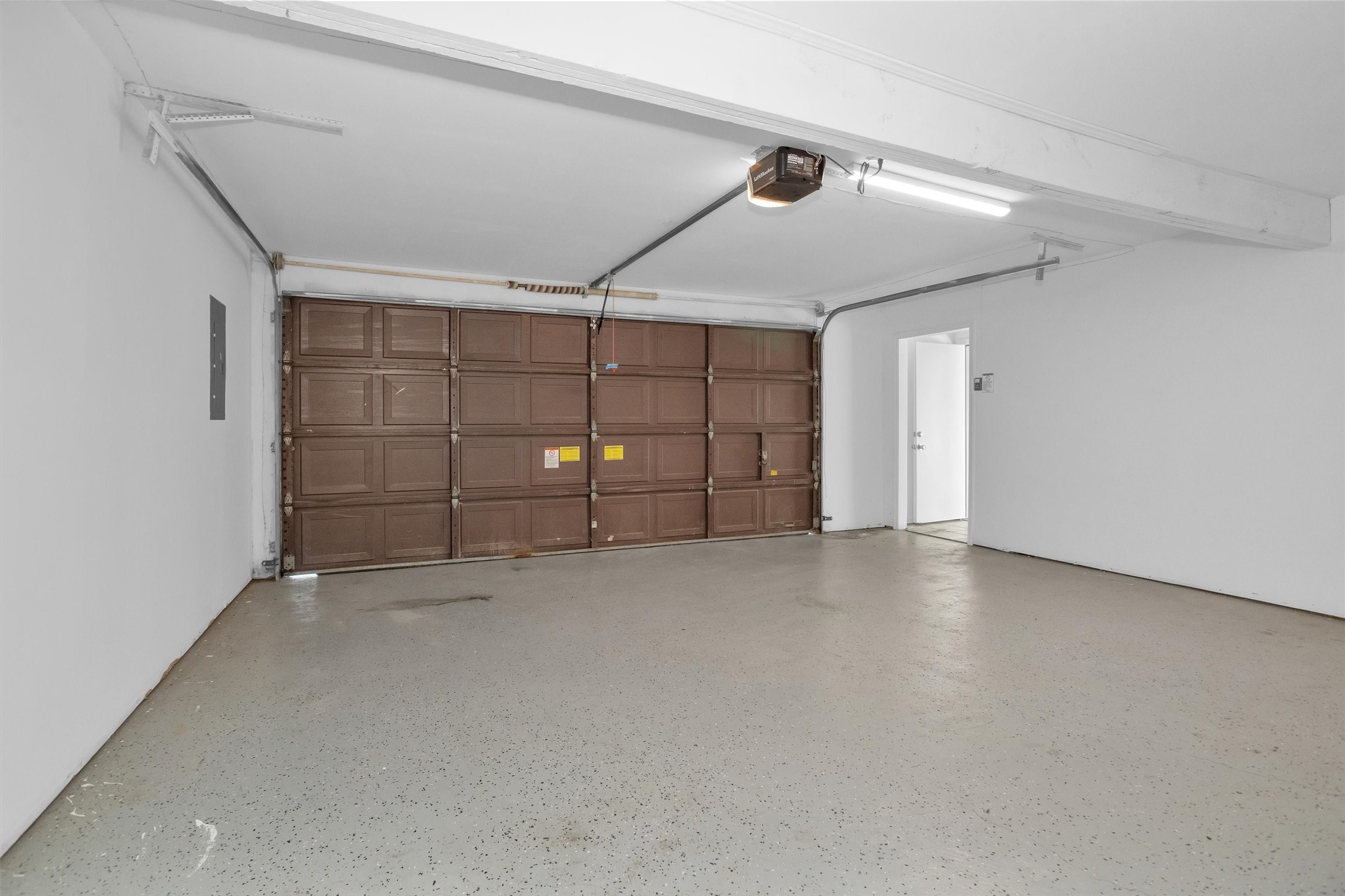 9115 Godstone Lane Spring, TX 77379 - Photo 41 of 46 The garage features durable epoxy flooring for easy maintenance.