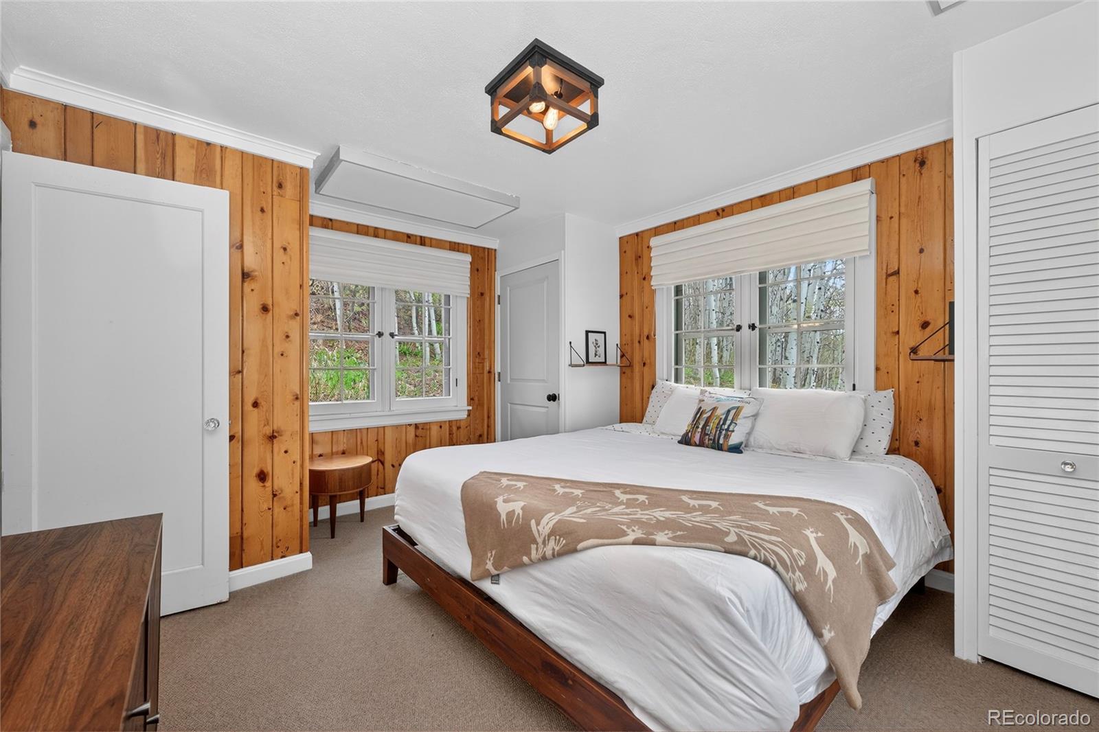 327 Vasquez Road, Unit E1 Winter Park, CO 80482 - Photo 21 of 43 a bedroom with a bed and a window