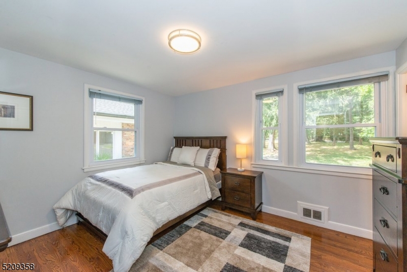 32 Parsonage Hill Road Short Hills, NJ 07078 - Photo 28 of 49 a bedroom with a bed and a window
