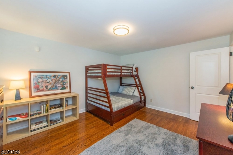32 Parsonage Hill Road Short Hills, NJ 07078 - Photo 30 of 49 a view of a room with wooden floor and couch