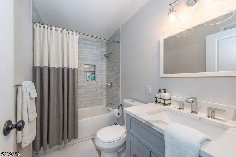 32 Parsonage Hill Road Short Hills, NJ 07078 - Photo 33 of 49 a bathroom with a sink toilet and shower