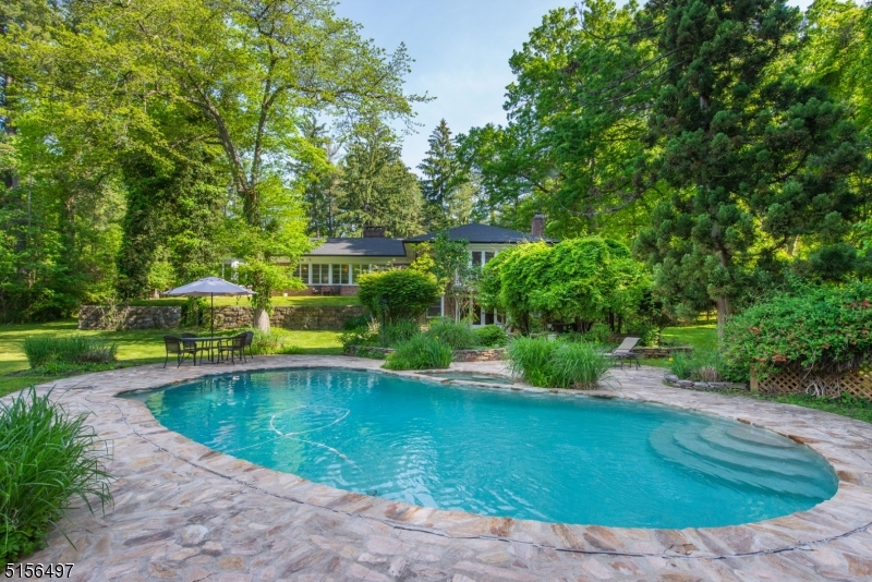 32 Parsonage Hill Road Short Hills, NJ 07078 - Photo 41 of 49 a view of a swimming pool with a patio
