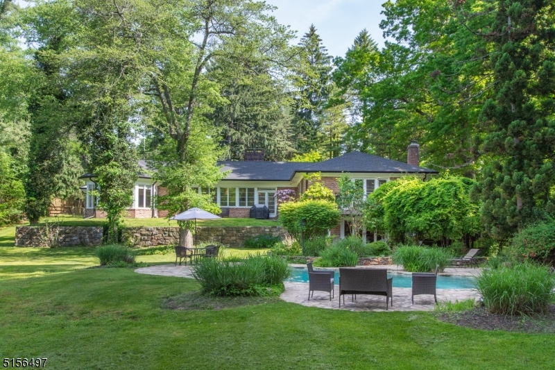 32 Parsonage Hill Road Short Hills, NJ 07078 - Photo 43 of 49 a front view of a house with a garden