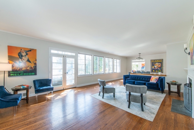 32 Parsonage Hill Road Short Hills, NJ 07078 - Photo 5 of 49 a living room with furniture a rug wooden floor and a floor to ceiling window