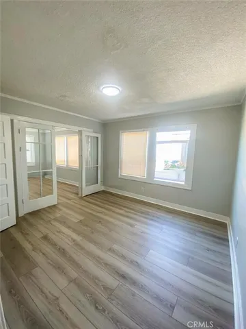 a kitchen with a sink a refrigerator and cabinets