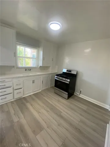a view of an empty room with a ceiling fan